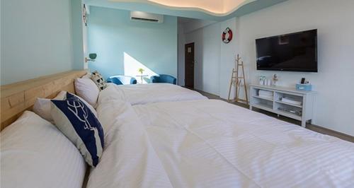 Postel nebo postele na pokoji v ubytování Auspice Garden Homestay