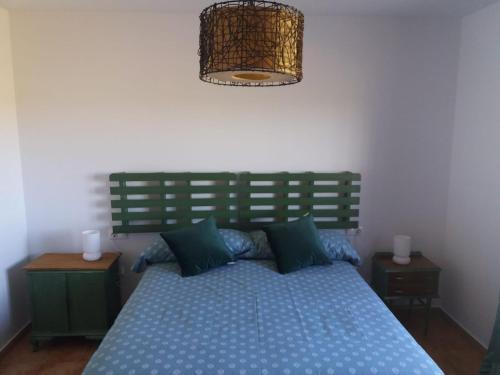 A bed or beds in a room at Casa Rural La Galana Albacete