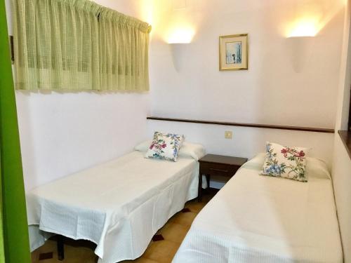 Posteľ alebo postele v izbe v ubytovaní JARDINS DEL MAR 46