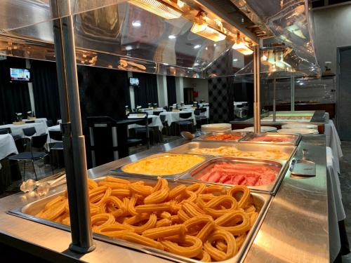 a buffet line with many different types of food at Hotel Condestable Iranzo in Jaén
