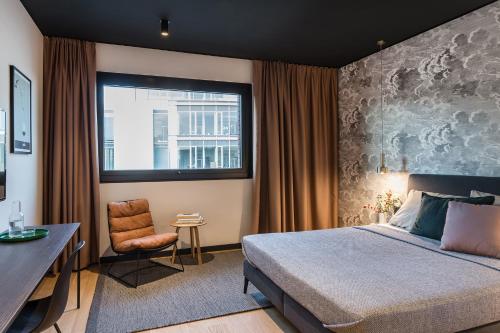Кровать или кровати в номере ipartment Hamburg HafenCity
