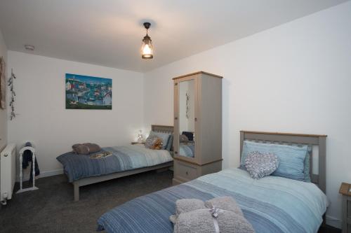 Postel nebo postele na pokoji v ubytování Seaesta Apartments