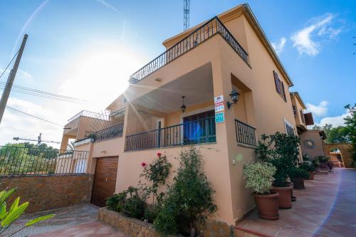 a house with plants in front of it at Villa Portals Nous by Priority in Portals Nous