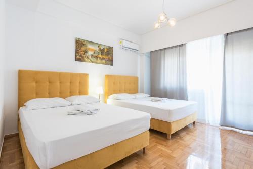 Una cama o camas en una habitación de Victoria Diamond Suites Apartments
