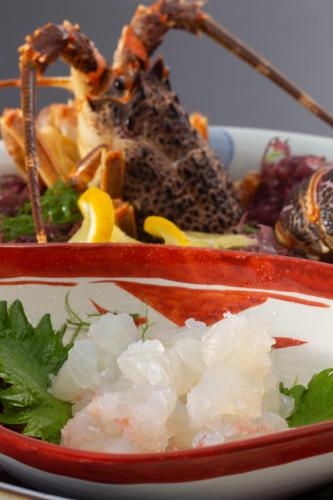 a plate of food with shrimp and other foods at Iseya, Seaview Private Oceanside Bath in Unzen
