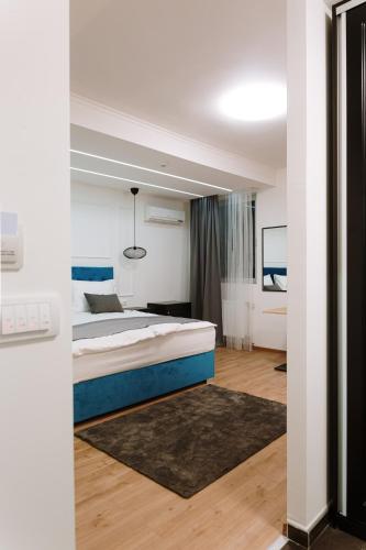 a bedroom with a large bed in a room at Boutique Hotel Nea in Brčko
