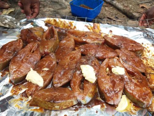 a pile of donuts sitting on top of tin foil at Heaven in Satinwoods in Tangalle
