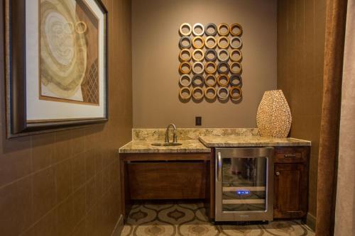 a bathroom with a sink and a counter with a sink at Resort Style Apartment/Home - The Woodlands in The Woodlands