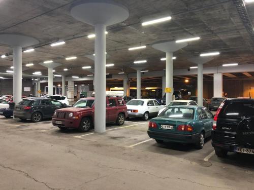 a parking lot full of cars in a parking garage at Inn Tourist Hostel in Helsinki