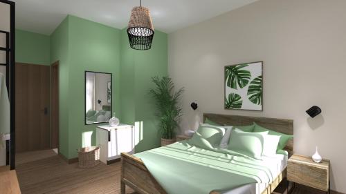 a green bedroom with a bed and a mirror at Aethon Airport Project-FREE SHUTTLE by GK Properties in Markopoulo