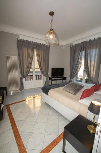 Postel nebo postele na pokoji v ubytování Compasso Suites