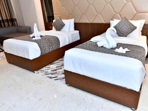 Postel nebo postele na pokoji v ubytování Be Inn Hotel