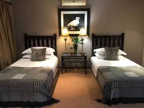 Katil atau katil-katil dalam bilik di The Crown Guest House