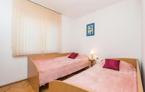 Postel nebo postele na pokoji v ubytování Casa Fiorella Ika-Opatija