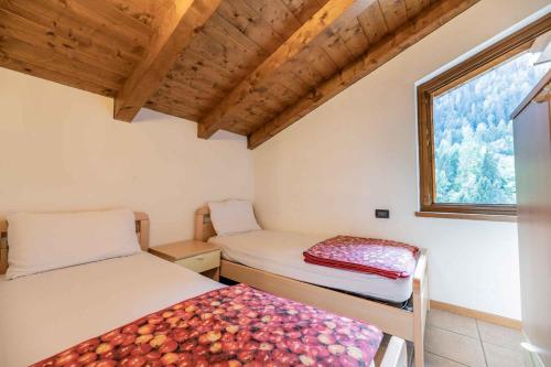 Posteľ alebo postele v izbe v ubytovaní Residence Arnica