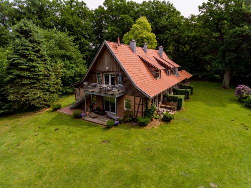an aerial view of a house with an orange roof at Gästehaus Gut Füchtel und Gut Welpe in Vechta