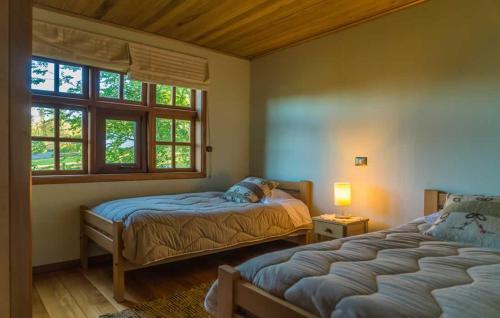 Llit o llits en una habitació de Cabañas Alcamar