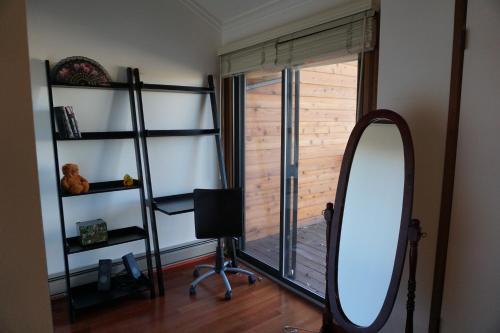a mirror in the corner of a room with a window at 2-3 bedroom /2 bath in Jackson
