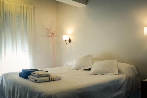 En eller flere senge i et værelse på Lares del Cerro