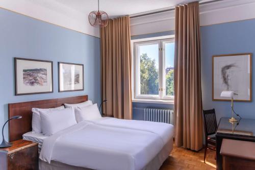 Llit o llits en una habitació de Radisson Blu Grand Hotel Tammer