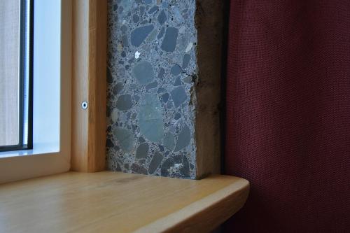 a room with a window sill with a wall at The Potato Storage in Svínafell