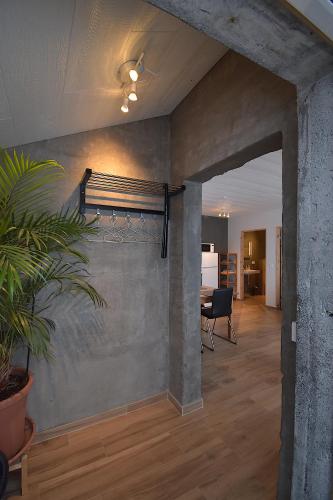 a living room with a table and a wall at The Potato Storage in Svínafell