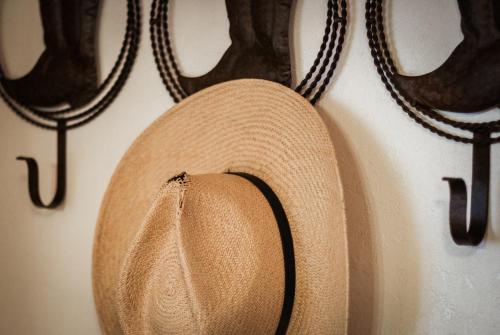 a straw hat is hanging on a wall at Heavenly Valley Lodge in South Lake Tahoe