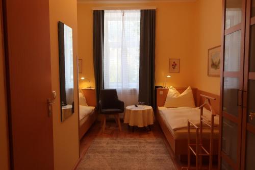 Cama o camas de una habitación en Kur- und Gästehaus Villa Anna