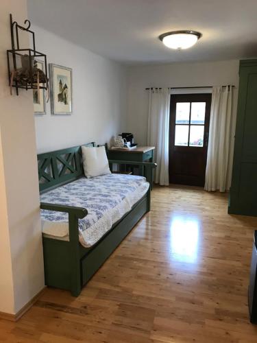 a bedroom with a bed and a desk in a room at Pension Wok in Český Krumlov