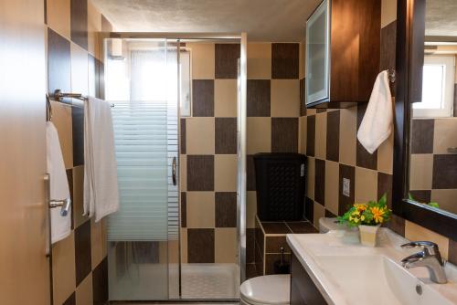 a bathroom with a sink and a toilet at Villa Katerina (Michalis) in Séllai