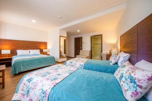 Säng eller sängar i ett rum på Hotel Nossa Senhora da Paz