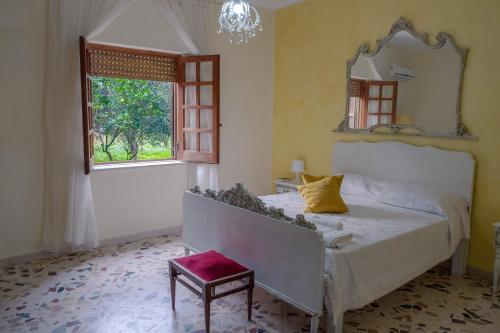 Ένα ή περισσότερα κρεβάτια σε δωμάτιο στο Il Fenicottero Guest House
