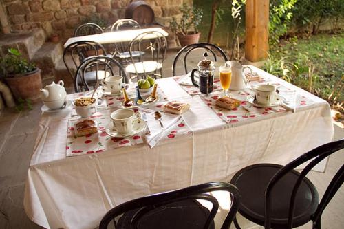 a white table with food and drinks on it at Casa Velarde in Torrelavega