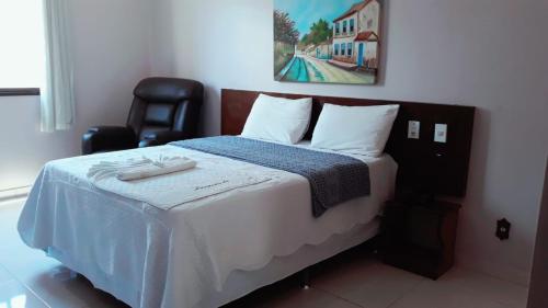 Кровать или кровати в номере Jacarandá Palace Hotel