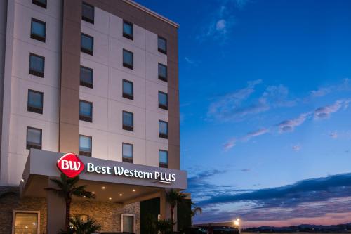 a hotel with a sign in front of a building at Best Western Plus Chihuahua Juventud in Chihuahua