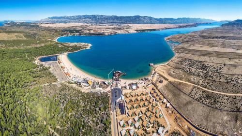 an aerial view of a reservoir with a lake at VILLA FUX ZRCE Novalja - direkt am Strand in Časka