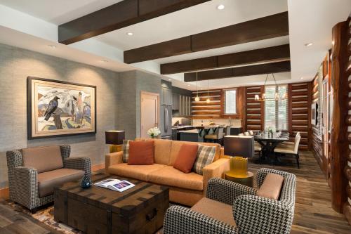 a living room with a couch and chairs and a table at Fairmont Jasper Park Lodge in Jasper