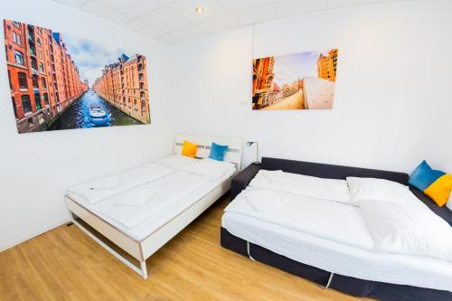 Säng eller sängar i ett rum på City Apartment Reeperbahn Hamburg