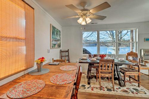 a dining room with a table and a ceiling fan at Lakefront Delta Cottage with Views, Canoe and Dock! in Delta