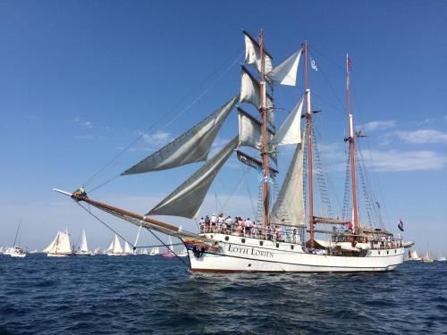 a group of people on a sail boat in the water at L'Imprenable vue mer in Crozon