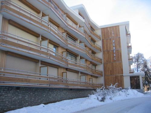 a large building with snow in front of it at 2 Alpes-locations Studio 4 personnes in Les Deux Alpes