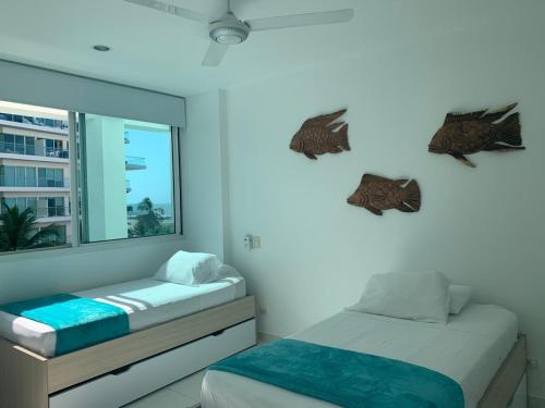 מיטה או מיטות בחדר ב-Cartagena Morros 3 Playa
