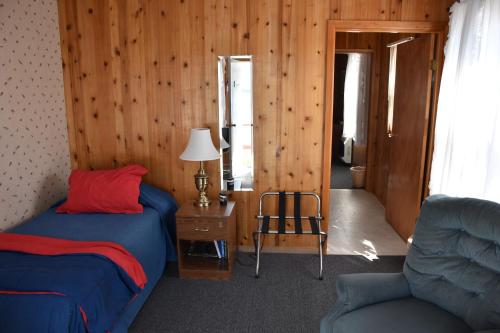 A bed or beds in a room at Zachar Bay Lodge