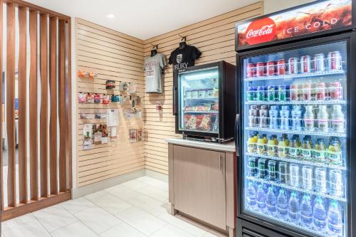 a refrigerator filled with lots of drinks in a store at Holiday Inn Express & Suites - Springfield North by IHG in Springfield