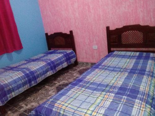 เตียงในห้องที่ Casa Beija-flor