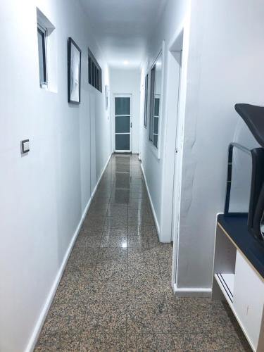 a hallway with white walls and a hallway with a door at Low price clean linen and free stuff No 2 plenty of on street parking G1 in Sydney