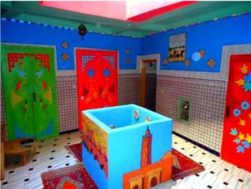a room with brightly colored doors and a room with a room at Hostel Kif-Kif in Marrakesh