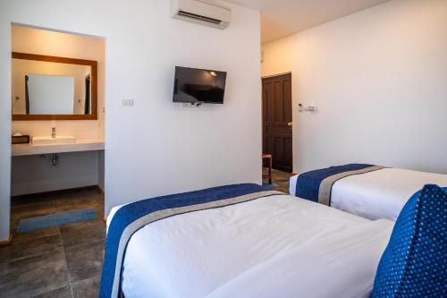 Postel nebo postele na pokoji v ubytování The Riviera Champasak