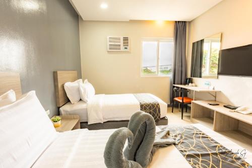 Postel nebo postele na pokoji v ubytování Hotel One