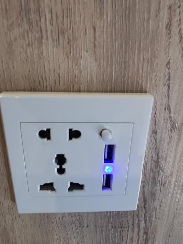 a white lightswitch on the ceiling of a room at TT Dorf Hotel Matang in Taiping
